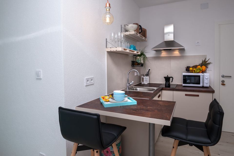 Studio A2, first floor - bar table and TV